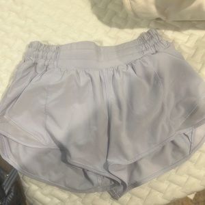 LULU LEMON light purple hotty hot shorts 2.5in 
Size 2 lightly worn